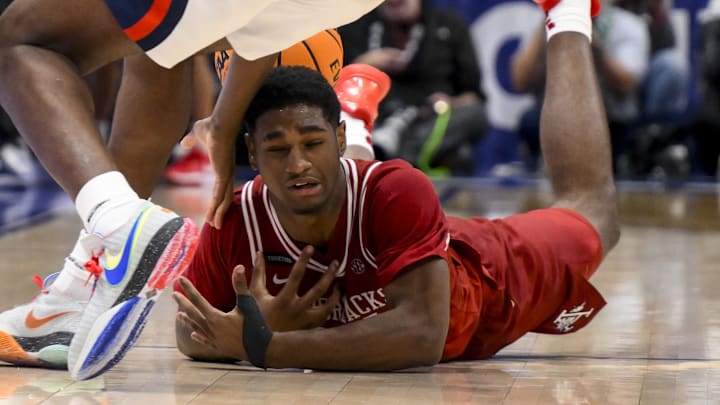 Ole Miss Rebels forward Malik Dia steals the ball from Arkansas Razorbacks forward Billy Richmond III during the second half at Bridgestone Arena.