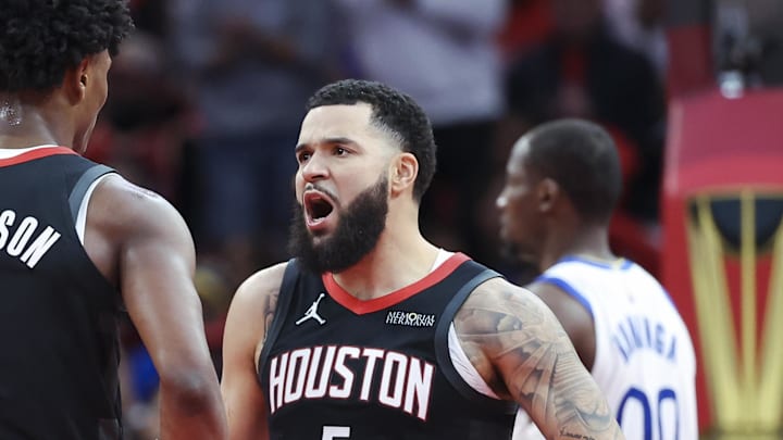 Dec 11, 2024; Houston, Texas, USA; Houston Rockets guard Fred VanVleet (5) reacts with forward Amen Thompson (1) after a play during the second quarter against the Golden State Warriors at Toyota Center. Mandatory Credit: Troy Taormina-Imagn Images