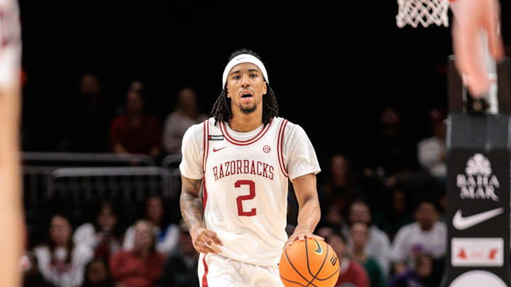 Arkansas Razorbacks guard Boogie Fland (2) brings the ball up court during the first half against the Illinois Fighting Illini at T-Mobile Center. 