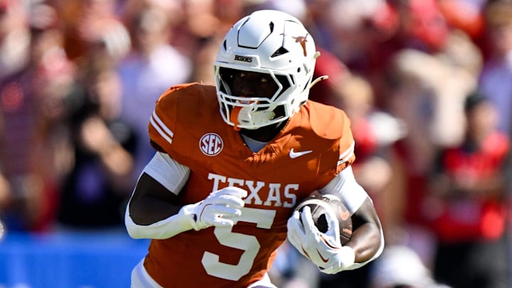 Oct 11, 2025; Dallas, Texas, USA; Texas Longhorns running back Quintrevion Wisner (5) runs with the ball against the Oklahoma Sooners during the first half at the Cotton Bowl. Mandatory Credit: Jerome Miron-Imagn Images Oct 11, 2025; Dallas, Texas, USA; Texas Longhorns running back Quintrevion Wisner (5) runs with the ball against the Oklahoma Sooners during the first half at the Cotton Bowl. Mandatory Credit: Jerome Miron-Imagn Images