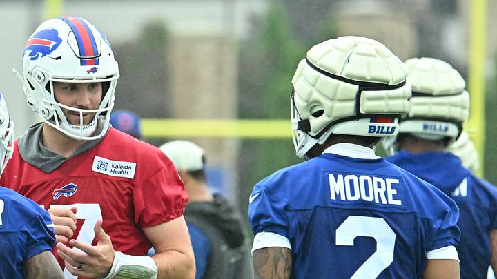 Jul 29, 2026; Rochester, NY, USA; Buffalo Bills quarterback Josh Allen (17) talks with wide receivers Mecole Hardman (1) and DJ Moore (2) during training camp at St. John Fisher University. Mandatory Credit: Mark Konezny-Imagn Images Jul 29, 2026; Rochester, NY, USA; Buffalo Bills quarterback Josh Allen (17) talks with wide receivers Mecole Hardman (1) and DJ Moore (2) during training camp at St. John Fisher University. Mandatory Credit: Mark Konezny-Imagn Images