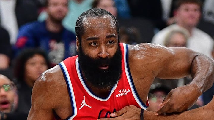Los Angeles Clippers guard James Harden moves to the basket against Brooklyn Nets center Nic Claxton.