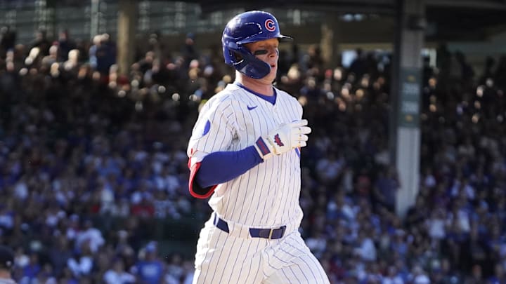 Chicago Cubs outfielder Pete Crow-Armstrong (4) beats out a bunt single against the Atlanta Braves during the sixth inning at Wrigley Field. 