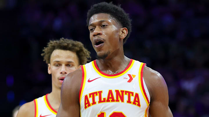 Dyson Daniels #5 and De'Andre Hunter #12 of the Atlanta Hawks react against the Sacramento Kings.