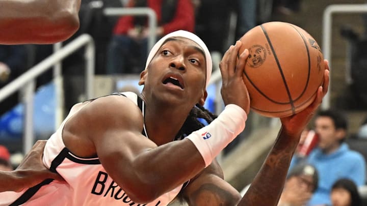 Nov 23, 2025; Toronto, Ontario, CAN;  Brooklyn Nets guard Terance Mann (14) controls the ball as Toronto Raptors guard Immanuel Quickley (5) defends in the first half at Scotiabank Arena. Mandatory Credit: Dan Hamilton-Imagn Images