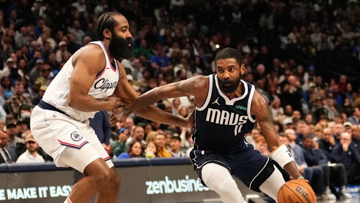 Dec 21, 2024; Dallas, Texas, USA; Dallas Mavericks guard Kyrie Irving (11) drives to the basket as LA Clippers guard James Harden (1) defends during the second half at American Airlines Center. Mandatory Credit: Chris Jones-Imagn Images