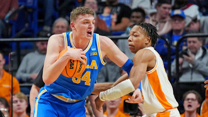 Mar 22, 2025; Lexington, KY, USA; UCLA Bruins forward Tyler Bilodeau (34) drives to the basket against Tennessee Volunteers guard Jordan Gainey (11) during the first half in the second round of the NCAA Tournament at Rupp Arena. Mandatory Credit: Aaron Doster-Imagn Images Mar 22, 2025; Lexington, KY, USA; UCLA Bruins forward Tyler Bilodeau (34) drives to the basket against Tennessee Volunteers guard Jordan Gainey (11) during the first half in the second round of the NCAA Tournament at Rupp Arena. Mandatory Credit: Aaron Doster-Imagn Images