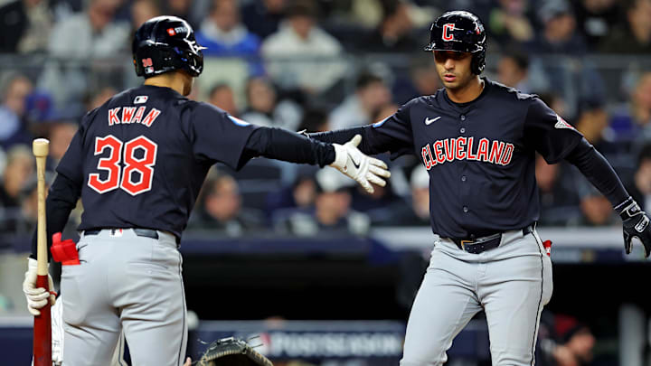 Oct 14, 2024; Bronx, New York, USA; Cleveland Guardians shortstop Brayan Rocchio (4) celebrates with outfielder Steven Kwan (38) after hitting a solo home run during the sixth inning against the New York Yankees in game one of the ALCS for the 2024 MLB Playoffs at Yankee Stadium. Mandatory Credit: Brad Penner-Imagn Images