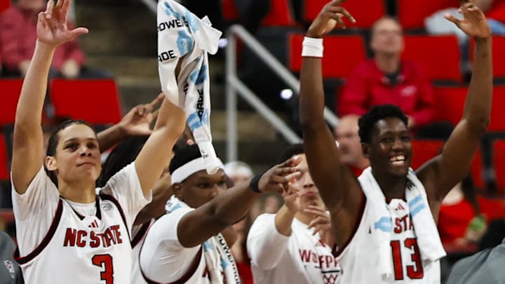 Dec 6, 2025; Raleigh, North Carolina, USA; NC State Wolfpack neck celebrates during the second half of the game against the Liberty Flames at Lenovo Center. Mandatory Credit: Jaylynn Nash-Imagn Images Dec 6, 2025; Raleigh, North Carolina, USA; NC State Wolfpack neck celebrates during the second half of the game against the Liberty Flames at Lenovo Center. Mandatory Credit: Jaylynn Nash-Imagn Images