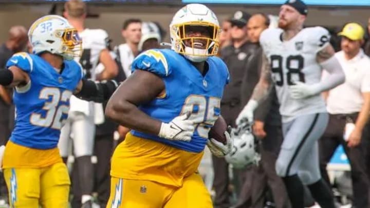 Chargers defensive tackle Poona Ford celebrates after his interception against the Raiders that sealed the Week 1 victory. (Robert Gauthier / Los Angeles Times)