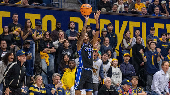 Jan 14, 2026; Berkeley, California, USA; Duke Blue Devils guard Isaiah Evans (3) shoots a three point shot against California Golden Bears forward Chris Bell (22) during the first half at Haas Pavilion. Mandatory Credit: Neville E. Guard-Imagn Images