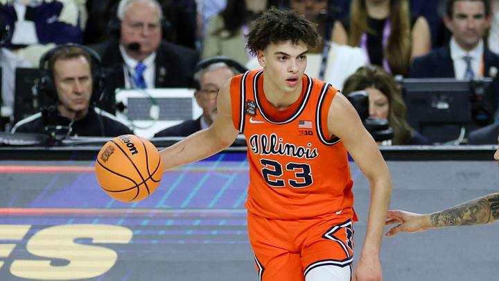 Apr 4, 2026; Indianapolis, IN, USA; Illinois Fighting Illini guard Keaton Wagler (23) dribbles the ball against UConn Huskies guard Solo Ball (1) in the first half during a semifinal of the Final Four of the men's 2026 NCAA Tournament at Lucas Oil Stadium. Mandatory Credit: Trevor Ruszkowski-Imagn Images Apr 4, 2026; Indianapolis, IN, USA; Illinois Fighting Illini guard Keaton Wagler (23) dribbles the ball against UConn Huskies guard Solo Ball (1) in the first half during a semifinal of the Final Four of the men's 2026 NCAA Tournament at Lucas Oil Stadium. Mandatory Credit: Trevor Ruszkowski-Imagn Images