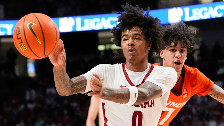 Nov 20, 2024; Birmingham, AL, USA; Alabama guard Labaron Philon (0) makes a pass after driving past Illinois forward Will Riley (7) in the CM Newton Classic at Legacy Arena. Alabama defeated Illinois 100-87. Mandatory Credit: Gary Cosby Jr.-Tuscaloosa News Nov 20, 2024; Birmingham, AL, USA; Alabama guard Labaron Philon (0) makes a pass after driving past Illinois forward Will Riley (7) in the CM Newton Classic at Legacy Arena. Alabama defeated Illinois 100-87. Mandatory Credit: Gary Cosby Jr.-Tuscaloosa News