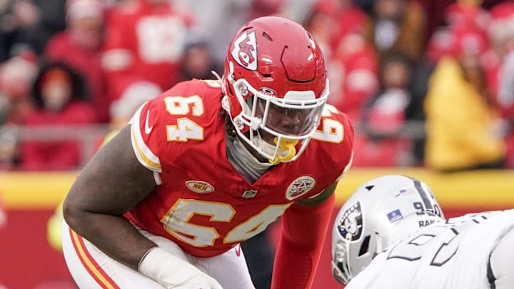 Dec 25, 2023; Kansas City, Missouri, USA; Kansas City Chiefs guard Joe Thuney (62) and offensive tackle Wanya Morris (64) at the line of scrimmage against the Las Vegas Raiders during the game at GEHA Field at Arrowhead Stadium. Mandatory Credit: Denny Medley-Imagn Images