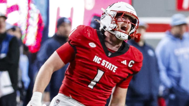 Nov 29, 2025; Raleigh, North Carolina, USA; NC State Wolfpack linebacker Caden Fordham (1) reacts to his tackle during the first half of the game against North Carolina Tar Heels at Carter-Finley Stadium.  Mandatory Credit: Jaylynn Nash-Imagn Images
