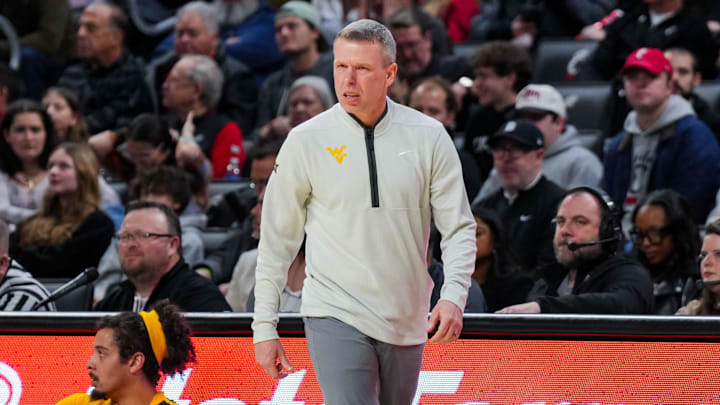 Feb 5, 2026; Cincinnati, Ohio, USA;  West Virginia Mountaineers head coach Ross Hodge works the sideline against the Cincinnati Bearcats in the first half at Fifth Third Arena. Mandatory Credit: Aaron Doster-Imagn Images