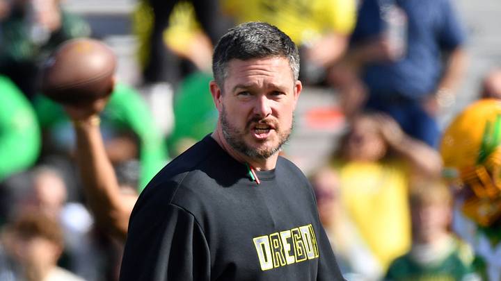 Oct 24, 2026; Champaign, Illinois, USA; Oregon Ducks head coach Dan Lanning watches his team before a game against the Illinois Fighting Illini at Gies Memorial Stadium. Oct 24, 2026; Champaign, Illinois, USA; Oregon Ducks head coach Dan Lanning watches his team before a game against the Illinois Fighting Illini at Gies Memorial Stadium.
