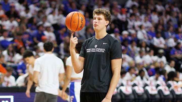 Jan 25, 2025; Gainesville, Florida, USA; Florida Gators center Micah Handlogten (3) spins a ball on his finger before a game against the Georgia Bulldogs at Exactech Arena at the Stephen C. O'Connell Center. Mandatory Credit: Matt Pendleton-Imagn Images