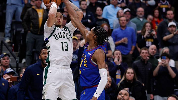 Jan 11, 2026; Denver, Colorado, USA; Milwaukee Bucks guard Ryan Rollins (13) attempts a shot as Denver Nuggets guard Peyton Watson (8) guards in the fourth quarter at Ball Arena. Mandatory Credit: Isaiah J. Downing-Imagn Images Jan 11, 2026; Denver, Colorado, USA; Milwaukee Bucks guard Ryan Rollins (13) attempts a shot as Denver Nuggets guard Peyton Watson (8) guards in the fourth quarter at Ball Arena. Mandatory Credit: Isaiah J. Downing-Imagn Images