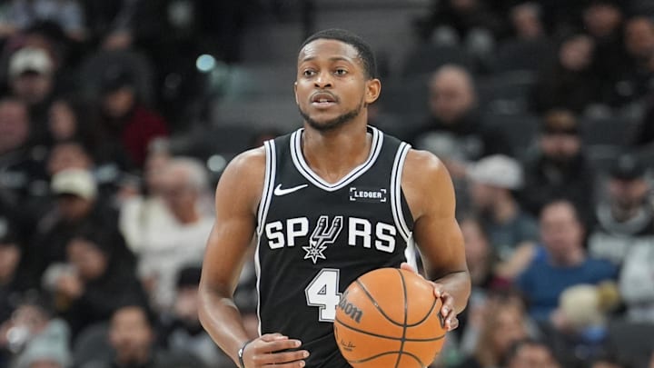 Jan 25, 2026; San Antonio, Texas, USA;  San Antonio Spurs guard De'aaron Fox (4) dribbles up the court in the first half against the New Orleans Pelicans at Frost Bank Center. Mandatory Credit: Daniel Dunn-Imagn Images