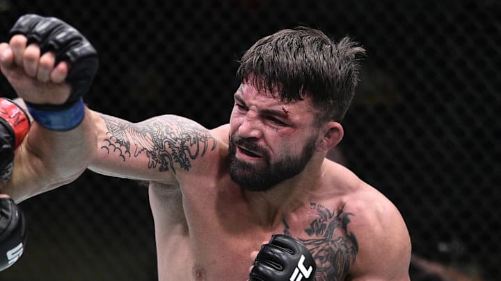 June 27, 2020; Las Vegas, NV, USA; Mike Perry (red gloves) punches Mickey Gall (blue gloves) during UFC Fight Night at the UFC APEX. Mandatory Credit: Chris Unger/Zuffa LLC via Imagn Images