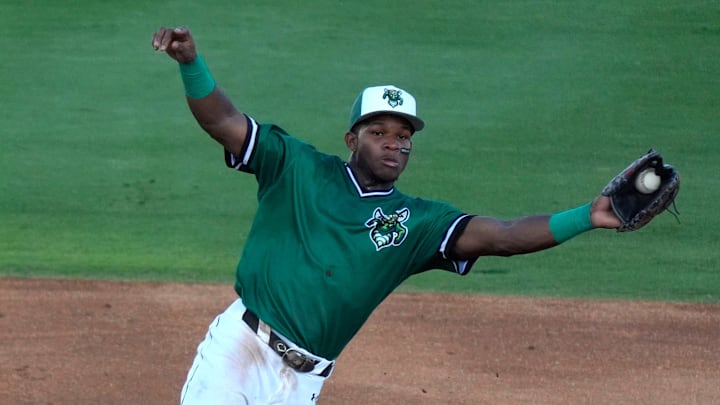 June 18, 2025; North Augusta, South Carolina, USA; Augusta GreenJacket infielder John Gil (7) jumps for the ball as Lynchburg Tommy Hawke (2) slides into second during the second game of the Auugsta GreenJackets and Lynchburg Hillcats baseball game at SRP Park. Mandatory Credit: Katie Goodale - Augusta Chronicle/USA TODAY NETWORK