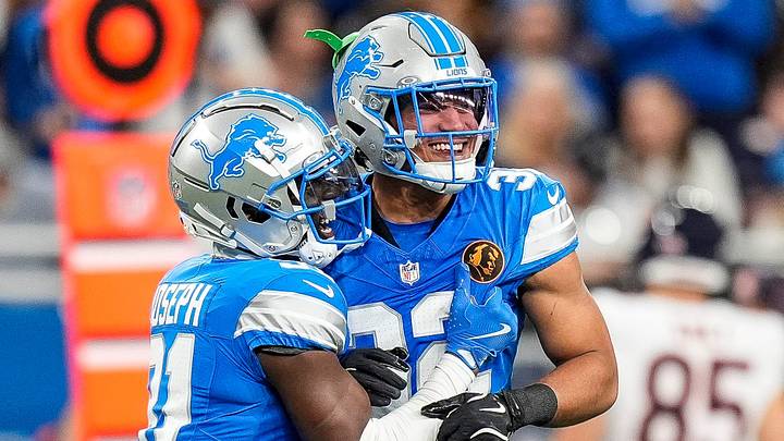 Detroit Lions safety Kerby Joseph (31), left, and safety Brian Branch (32) celebrate a play
