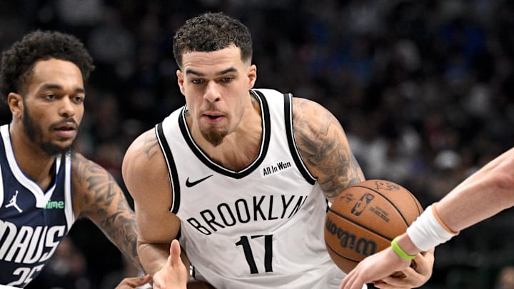 Dec 12, 2025; Dallas, Texas, USA; Brooklyn Nets forward Michael Porter Jr. (17) moves the ball past Dallas Mavericks forward P.J. Washington (25) during the game between the Mavericks and the Nets at the American Airlines Center. Mandatory Credit: Jerome Miron-Imagn Images