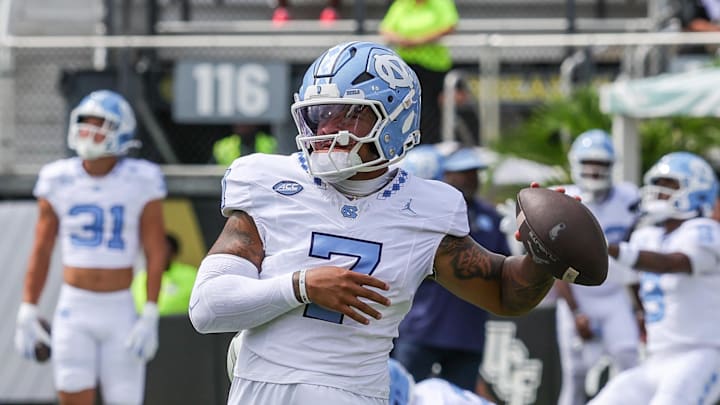 Sep 20, 2025; Orlando, Florida, USA; North Carolina Tar Heels quarterback Gio Lopez (7) warms up before the game against the UCF Knights at the Bounce House Stadium. Mandatory Credit: Mike Watters-Imagn Images