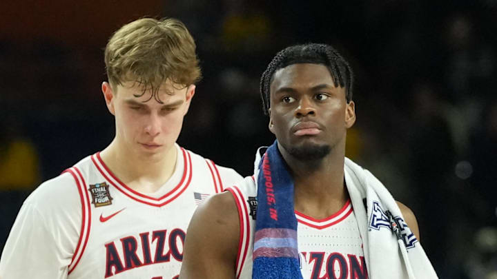 Apr 4, 2026; Indianapolis, IN, USA; Arizona Wildcats guard Dwayne Aristode (2), Arizona Wildcats guard Anthony Dell'orso (3) and Arizona Wildcats guard Jackson Cook (11) react after losing to the Michigan Wolverines during a semifinal of the Final Four of the men's 2026 NCAA Tournament at Lucas Oil Stadium. Mandatory Credit: Robert Deutsch-Imagn Images Apr 4, 2026; Indianapolis, IN, USA; Arizona Wildcats guard Dwayne Aristode (2), Arizona Wildcats guard Anthony Dell'orso (3) and Arizona Wildcats guard Jackson Cook (11) react after losing to the Michigan Wolverines during a semifinal of the Final Four of the men's 2026 NCAA Tournament at Lucas Oil Stadium. Mandatory Credit: Robert Deutsch-Imagn Images