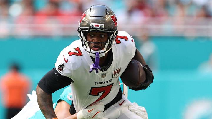 Dec 28, 2025; Miami Gardens, Florida, USA; Tampa Bay Buccaneers running back Bucky Irving (7) is tackled by Miami Dolphins linebacker Cameron Goode (53) during the first quarter at Hard Rock Stadium. Mandatory Credit: Nathan Ray Seebeck-Imagn Images