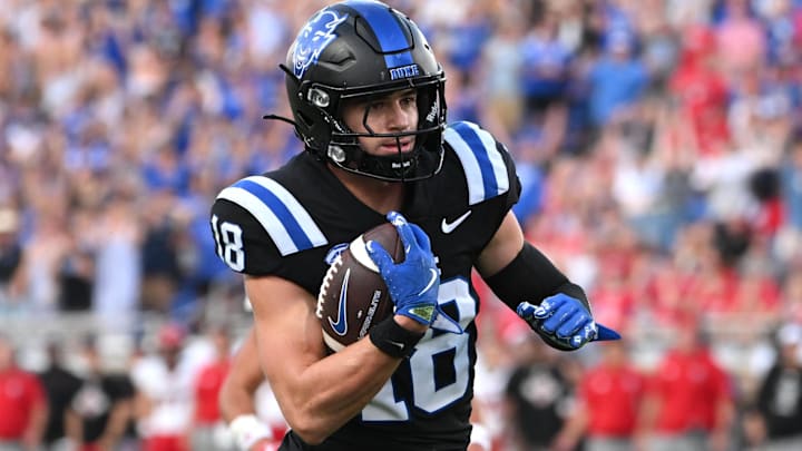 Sep 20, 2025; Durham, North Carolina, USA; Duke Blue Devils wide receiver Cooper Barkate (18) runs for a touchdown in the third quarter against the NC State Wolfpack at Wallace Wade Stadium. Mandatory Credit: Zachary Taft-Imagn Images