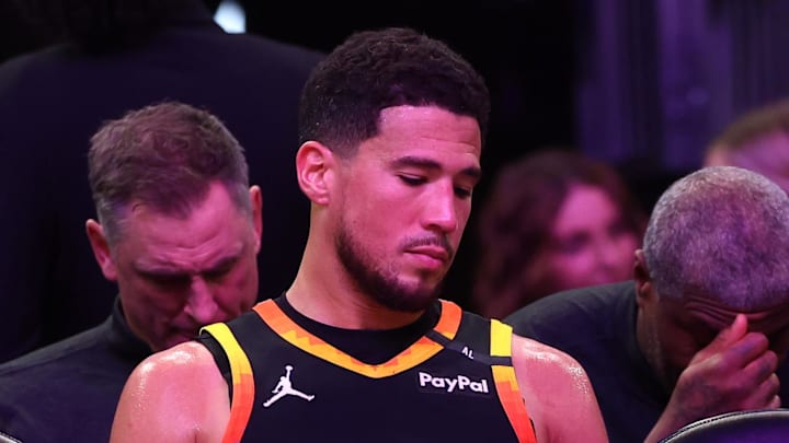 Apr 9, 2025; Phoenix, Arizona, USA; Phoenix Suns guard Bradley Beal (3) and guard Devin Booker (1) react on the bench against the Oklahoma City Thunder during the second half at Footprint Center. Mandatory Credit: Mark J. Rebilas-Imagn Images