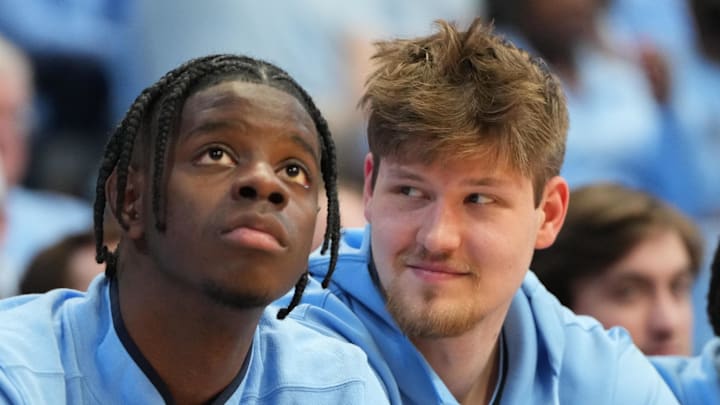 Feb 14, 2026; Chapel Hill, North Carolina, USA; North Carolina Tar Heels forward Caleb Wilson (8) and center Henri Veesaar (13) on the bench in the second half at Dean E. Smith Center. Mandatory Credit: Bob Donnan-Imagn Images