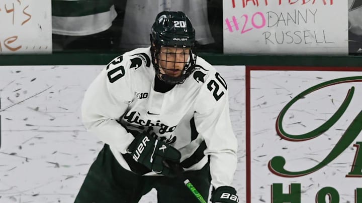 Daniel Russell of MSU moves the puck against Notre Dame, Saturday, Nov. 15, 2024, at Munn Ice Arena. MSU won 4-3 to sweep the series.