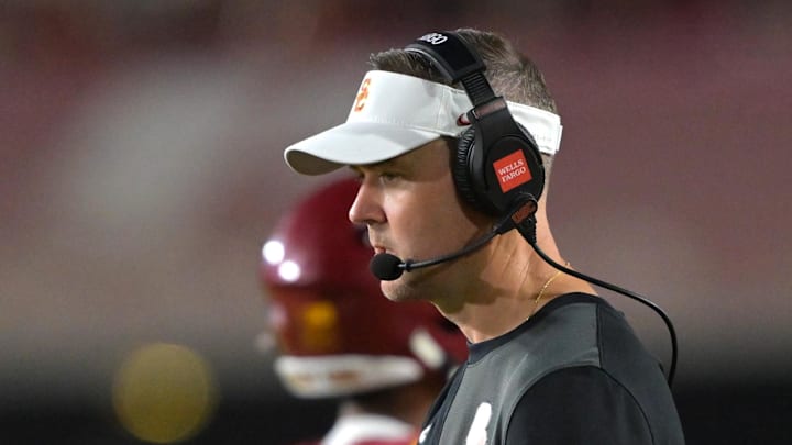 Sep 6, 2025; Los Angeles, California, USA; USC Trojans head coach Lincoln Riley shakes hands with running back Eli Sanders (1) after a touchdown during the second half against the Georgia Southern Eagles at United Airlines Field at the Los Angeles Memorial Coliseum. Mandatory Credit: Jayne Kamin-Oncea-Imagn Images