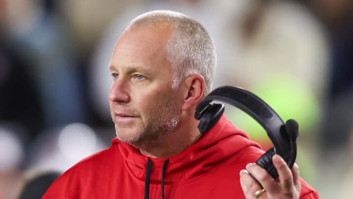 Nov 21, 2024; Atlanta, Georgia, USA; North Carolina State Wolfpack head coach Dave Doeren talks to a referee against the Georgia Tech Yellow Jackets in the fourth quarter at Bobby Dodd Stadium at Hyundai Field. Mandatory Credit: Brett Davis-Imagn Images
