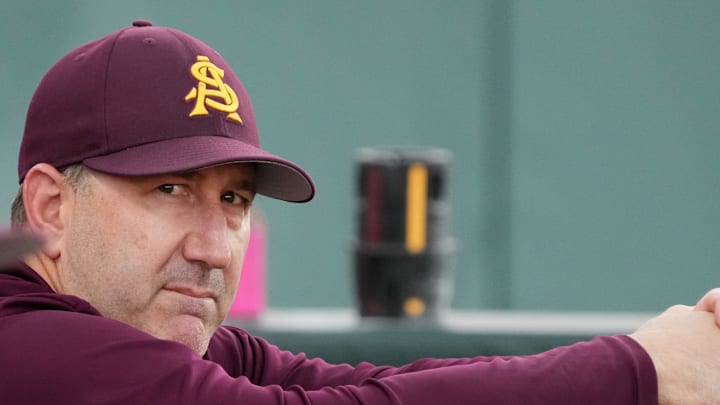 ASU Sun Devil head caoch Willie Bloomquist stands in the dugout during their game against the New Mexico State Aggies at Phoenix Municipal Stadium on March 25, 2026. ASU Sun Devil head caoch Willie Bloomquist stands in the dugout during their game against the New Mexico State Aggies at Phoenix Municipal Stadium on March 25, 2026.