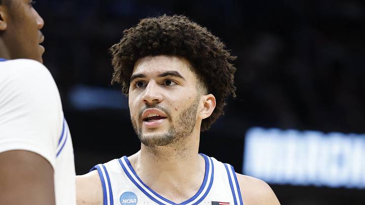 Mar 29, 2026; Washington, DC, USA; Duke Blue Devils forward Cameron Boozer (12) talks to Blue Devils center Patrick Ngongba (21) during a stoppage in play against the UConn Huskies in the second half during an Elite Eight game of the East Regional of the men's 2026 NCAA Tournament at Capital One Arena. Mandatory Credit: Amber Searls-Imagn Images