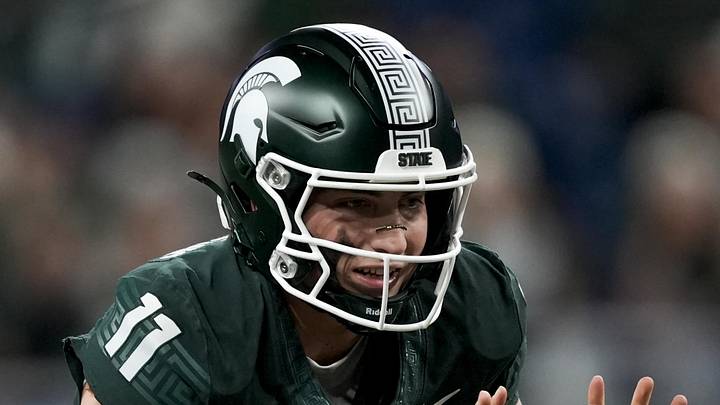 Nov 29, 2025; Detroit, Michigan, USA; Michigan State quarterback Alessio Milivojevic (11) prepares to take a snap in the first quarter against Maryland at Ford Field. Nov 29, 2025; Detroit, Michigan, USA; Michigan State quarterback Alessio Milivojevic (11) prepares to take a snap in the first quarter against Maryland at Ford Field.