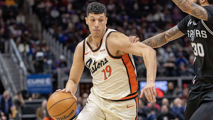 Mar 25, 2025; Detroit, Michigan, USA; Detroit Pistons forward Simone Fontecchio (19) moves the ball up court as San Antonio Spurs forward Julian Champagnie (30) defends during the first half at Little Caesars Arena. Mandatory Credit: David Reginek-Imagn Images Mar 25, 2025; Detroit, Michigan, USA; Detroit Pistons forward Simone Fontecchio (19) moves the ball up court as San Antonio Spurs forward Julian Champagnie (30) defends during the first half at Little Caesars Arena. Mandatory Credit: David Reginek-Imagn Images