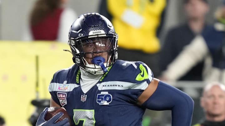 Seattle Seahawks linebacker Uchenna Nwosu runs to score a touchdown against the New England Patriots.