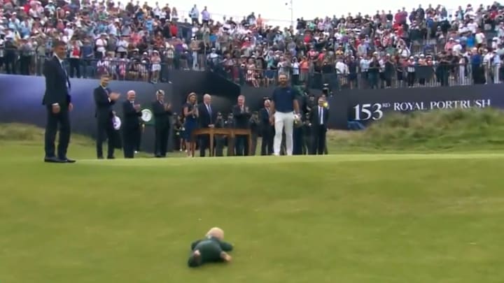Scottie Scheffler's young son Bennett fell on the hill beside the 18th green, creating a sweet moment after the trophy presentation. Scottie Scheffler's young son Bennett fell on the hill beside the 18th green, creating a sweet moment after the trophy presentation.