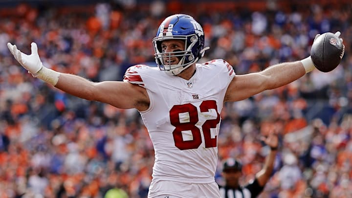 Oct 19, 2025; Denver, Colorado, USA; New York Giants tight end Daniel Bellinger (82) celebrates after scoring a touchdown during the first half against the Denver Broncos.