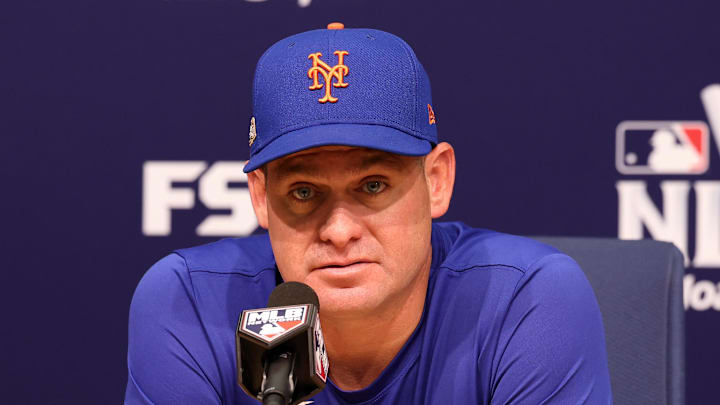 Oct 13, 2024; Los Angeles, California, USA; New York Mets manager Carlos Mendoza (64) speaks to the media before game one of the NLCS for the 2024 MLB Playoffs at Dodger Stadium. Mandatory Credit: Kiyoshi Mio-Imagn Images