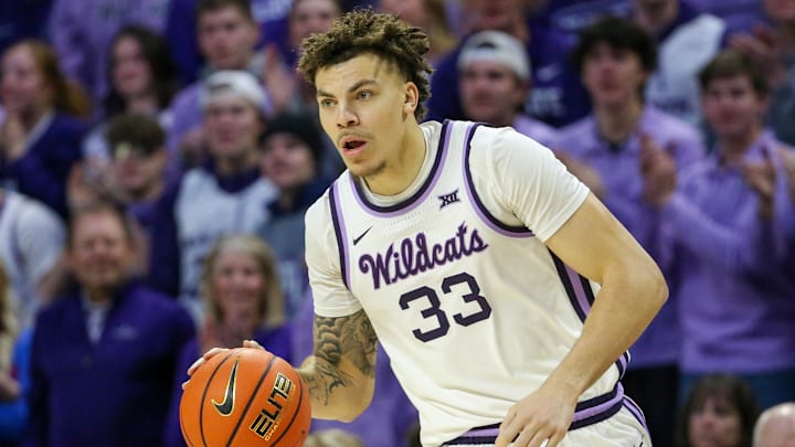 Feb 8, 2025; Manhattan, Kansas, USA; Kansas State Wildcats forward Coleman Hawkins (33) brings the ball up court during the first half against the Kansas Jayhawks at Bramlage Coliseum. Mandatory Credit: Scott Sewell-Imagn Images
