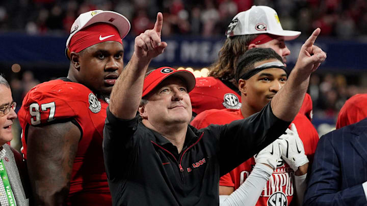 Georgia coach Kirby Smart celebrates with his team after the winning the SEC championship game against Texas in Atlanta, on Saturday, Dec. 7, 2024. Georgia won 22-19.