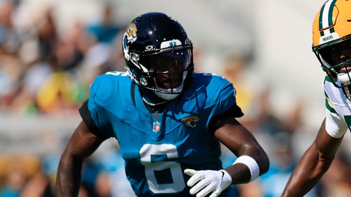 Green Bay Packers wide receiver Romeo Doubs (87) rushes for yards against Jacksonville Jaguars safety Darnell Savage (6) during the first quarter of an NFL football matchup Sunday, Oct. 27, 2024 at EverBank Stadium in Jacksonville, Fla. The Packers edged the Jaguars 30-27 on a last-second field goal. [Corey Perrine/Florida Times-Union]