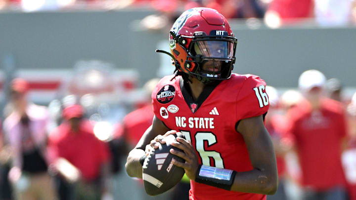 Sep 28, 2024; Raleigh, North Carolina, USA; North Carolina State Wolfpack quarter back CJ Bailey (16) looks for an opening for a throw against the Northern Illinois Huskies at Carter-Finley Stadium. Mandatory Credit: Zachary Taft-Imagn Images Sep 28, 2024; Raleigh, North Carolina, USA; North Carolina State Wolfpack quarter back CJ Bailey (16) looks for an opening for a throw against the Northern Illinois Huskies at Carter-Finley Stadium. Mandatory Credit: Zachary Taft-Imagn Images