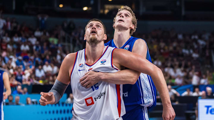 Lauri Markkanen and Nikola Jokic battling for a rebound in Finland vs. Serbia at EuroBasket 2025.